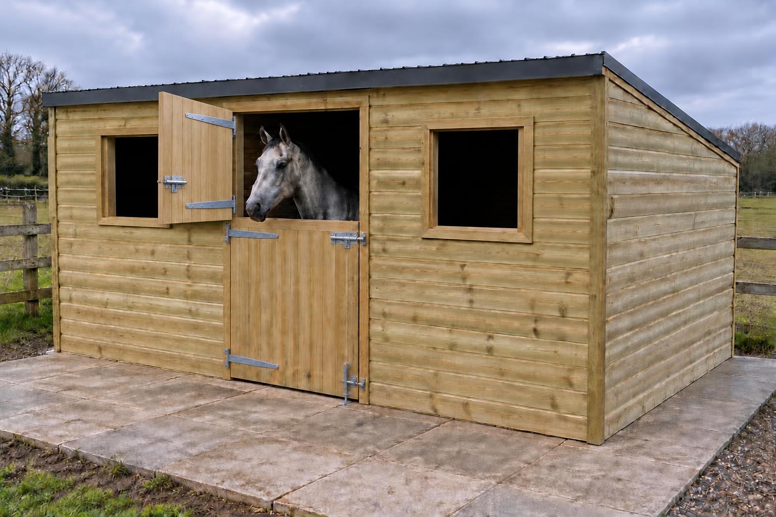 Grey horse looking over a timber stable door